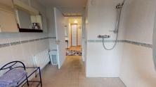 Large, fully tiled bathroom with walk-in shower